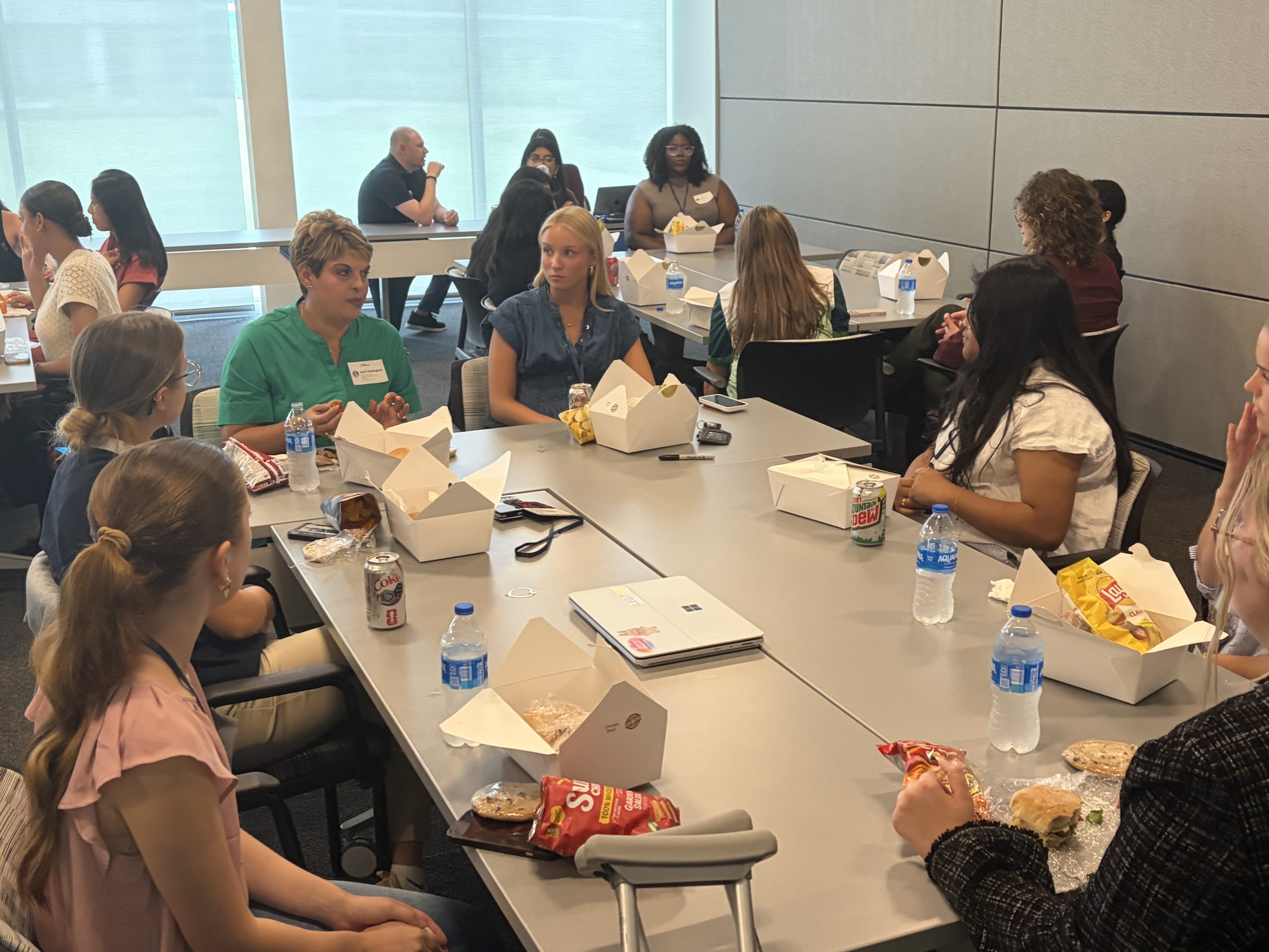 Participants have lunch with mentors and speakers at each location